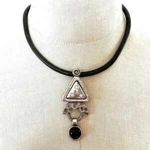 Silver tone and black pendant necklace on cord